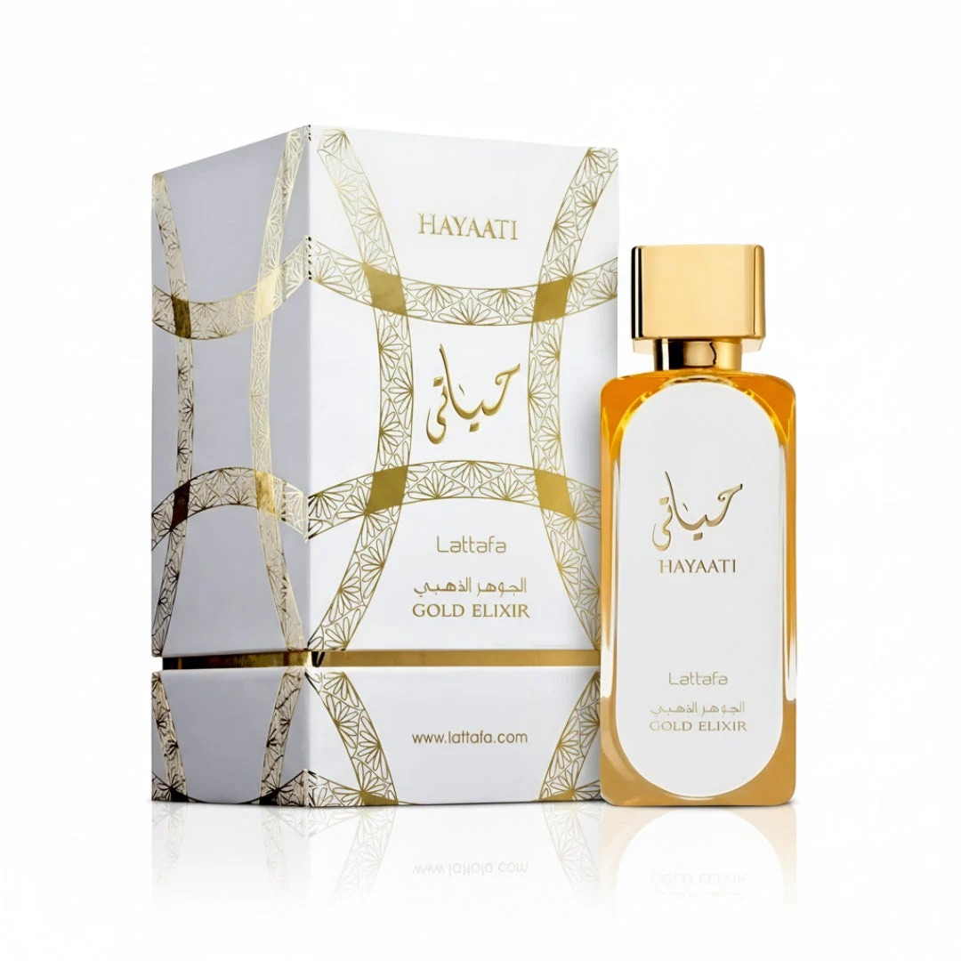 Hayaati Gold Elixir Lattafa unisex perfume bottle next gift box white background gold cap