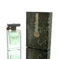 Atlas Lattafa edp green liquid clear glass beside dark grey packaging white background