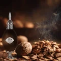 Hala Lattafa edp bottle surrounded walnut wood chips smoke dark background closeup