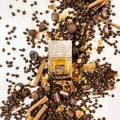 Khamrah Qahwa Lattafa edp unisex perfume bottle surrounded chocolates coffee beans cinnamon