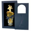 Maahir Lattafa golden perfume in black gift box white background closeup side angle