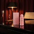 Now Women Rave Lattafa edp on piano table dim room setting closeup