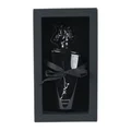 Maahir Black Edition Lattafa perfume bottle in gift box white background closeup side