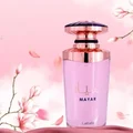 Mayar Lattafa edp perfume purple bottle soft pink flowers falling background