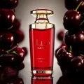 Mayar Cherry Intense Lattafa red edp surrounded cherries closeup front side view