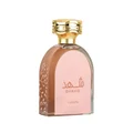 Shahd Lattafa perfume glass bottle pink liquid gold cap closeup front view white surface minimalistic