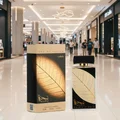 Najdia in Gold Lattafa unisex edp displayed mall floor closeup front packaging