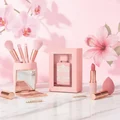 Badee Al Oud Noble Blush Lattafa pink packaging marble table surrounded makeup items