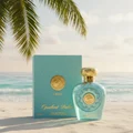 Opulent Dubai Lattafa perfume on beach sand palm tree turquoise blue packaging gold