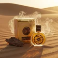 Oud Al Sahraa Lattafa unisex fragrance desert landscape surrounded smoke driftwood gold packaging