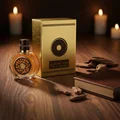 Oud Al Sahraa Lattafa bottle wooden table gold packaging surrounded candles
