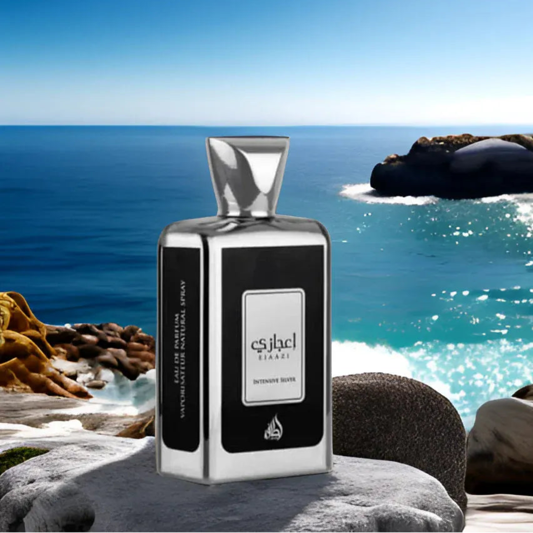 Ejaazi Intensive Lattafa silver unisex perfume bottle on rock near ocean view landscape