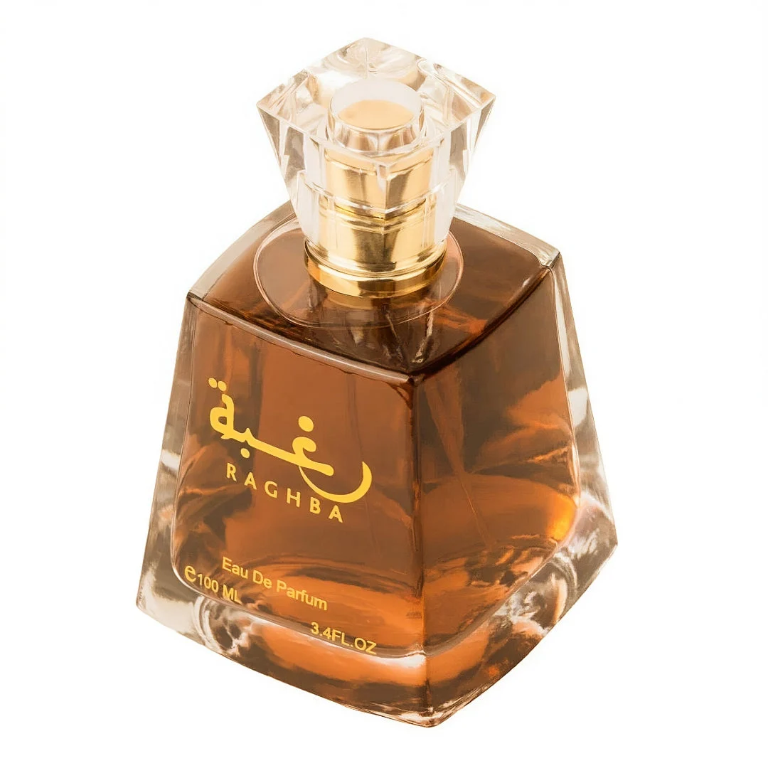 Bottle of Lattafa Raghba edp unisex in brown liquid closeup view white background gold