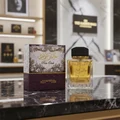 Khalis Pure Oudi Lattafa edp perfume glass on marble table next purple packaging