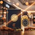 Raed Luxe Lattafa perfume bottle surrounded spices on table shopping mall background golden lights