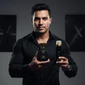 Man in black shirt holding Lattafa Raghba edp bottles closeup view front body shot