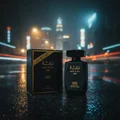 Lattafa raghba black edp on wet road at night beside its packaging