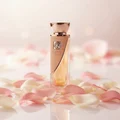 Reve Rose Vurv Lattafa edp surrounded pink white petals on shiny surface closeup view