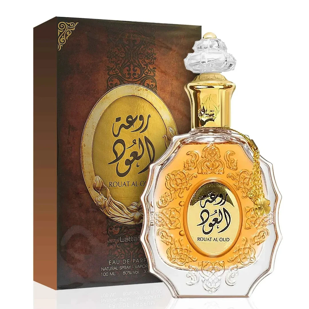 Lattafa rouat al oud unisex edp fragrance in a golden ornate glass bottles next brown