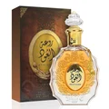 Lattafa rouat al oud unisex edp fragrance in a golden ornate glass bottles next brown