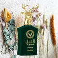 Lattafa Safeer Al Noble green fragrance surrounded by dried flowers golden deer cap closeup view