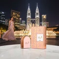 Shahd Lattafa perfume on marble table Kuala Lumpur cityscape at night side view