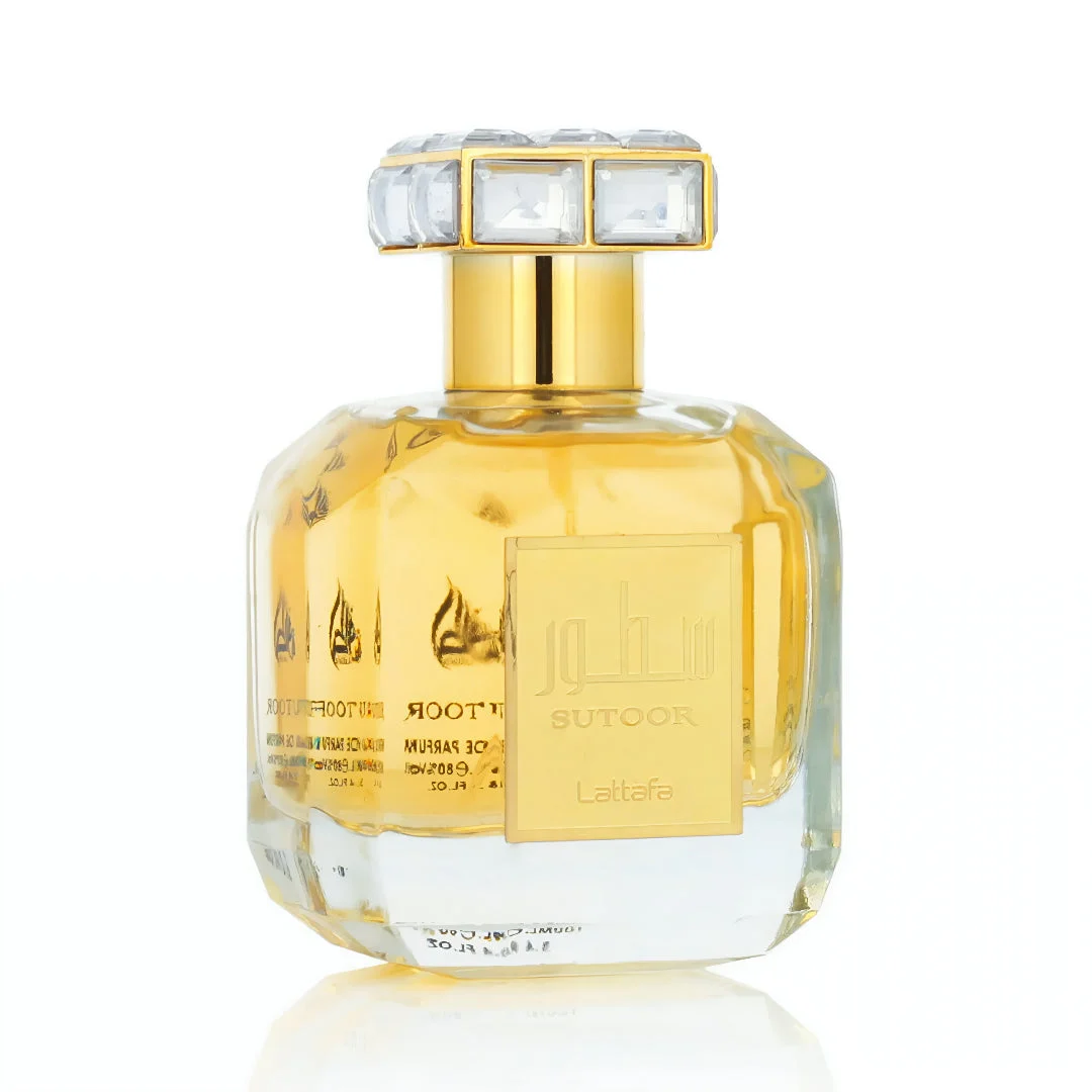 Sutoor Lattafa edp women golden liquid clear glass fragrance bottles closeup side view