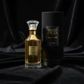Lattafa Velvet Oud unisex perfume bottle next to black box on velvety surface closeup view side angle low light setup dark