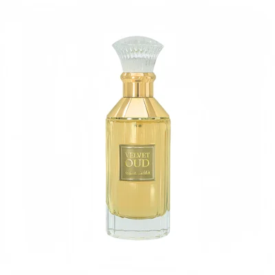 Lattafa Velvet oud unisex fragrance in a glass yellow liquid filled crystal clear elegant gold caped