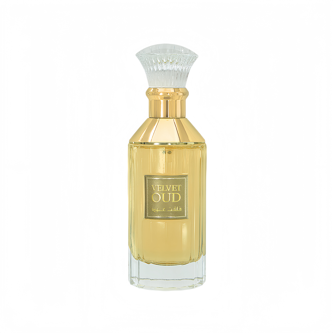 Lattafa Velvet oud unisex fragrance in a glass yellow liquid filled crystal clear elegant gold caped