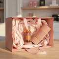 Velvet Rose Lattafa unisex fragrance pink bag wooden table closeup view side angle shot