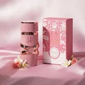 Yara Elixir Lattafa pink perfume bottle next flower on silk background rose gold details packaging