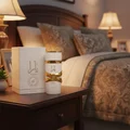 Yara Moi Lattafa edp women fragrance on bedside table bedroom setting closeup side perspective