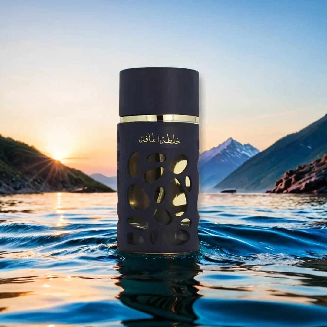 Lattafa Khalta Blend Of Lattafa Eau De Parfum 100ml — A dark blue perfume bottle with a textured, carved outer layer revealing gold accents inside, next to its matching cap with a gold circular emblem. | Lattafa Khalta Blend Of Lattafa Eau De Parfum 100ml — Botol minyak wangi biru gelap dengan lapisan luar bertekstur