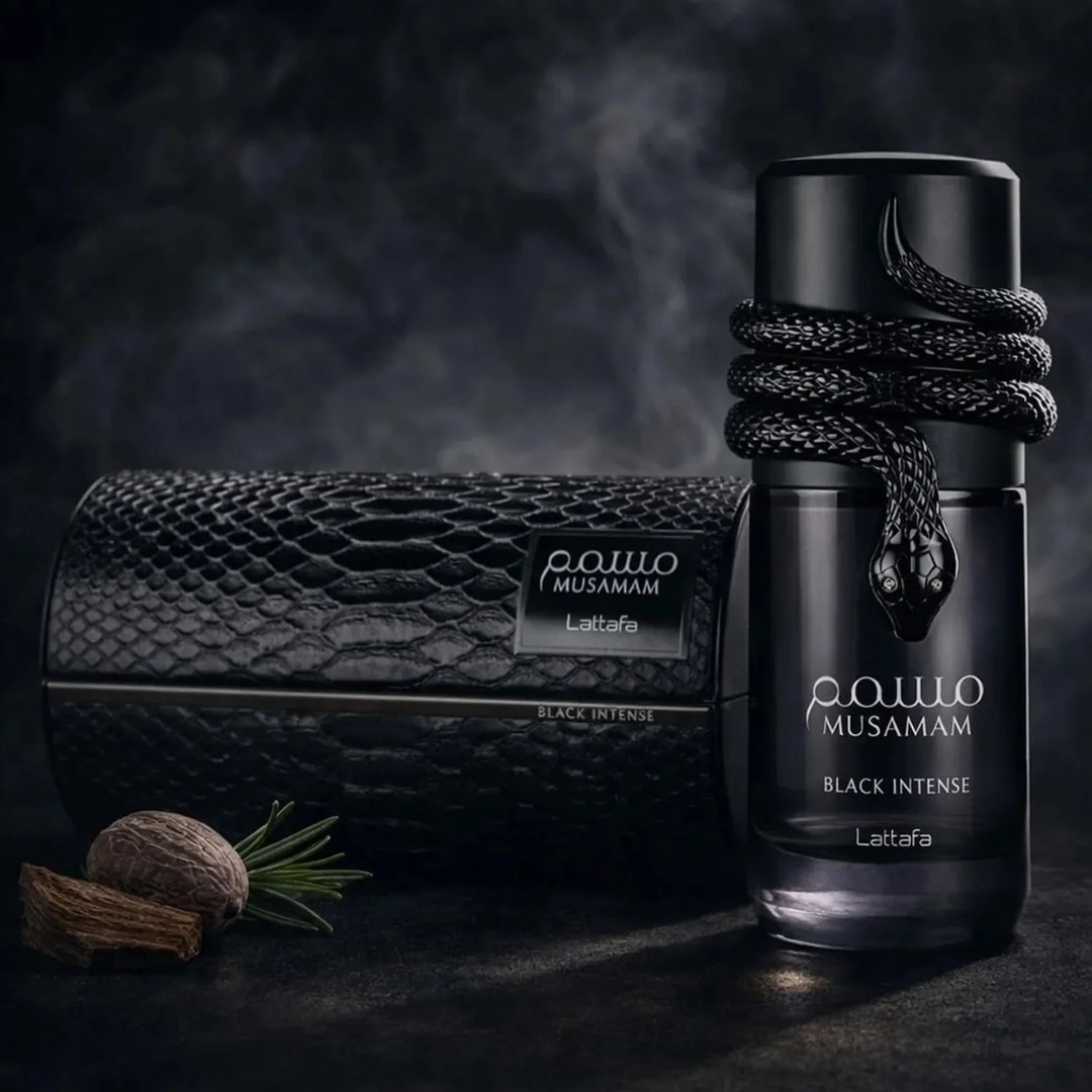 Lattafa Musamam Black Intense 100ml by Lattafa — Black snake coiled around a dark perfume bottle, with a textured black case in the background. | Lattafa Musamam Black Intense 100ml by Lattafa — Ular hitam melilit botol minyak wangi gelap, dengan bekas bertekstur hitam di latar belakang.