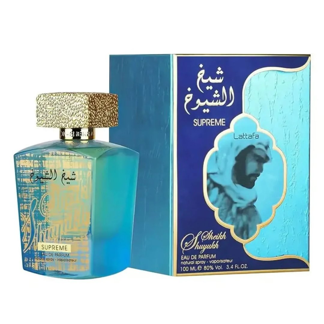 Lattafa Sheikh Al Shuyukh Supreme by Lattafa 100ml — A blue box with Arabic calligraphy and a portrait of a man in a headscarf is next to a clear glass perfume bottle with a gold textured cap and light green liquid. | Lattafa Sheikh Al Shuyukh Supreme by Lattafa 100ml — Kotak biru dengan kaligrafi Arab dan potret