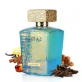 Lattafa Sheikh Al Shuyukh Supreme by Lattafa 100ml — A blue box with Arabic calligraphy and a portrait of a man in a headscarf is next to a clear glass perfume bottle with a gold textured cap and light green liquid. | Lattafa Sheikh Al Shuyukh Supreme by Lattafa 100ml — Kotak biru dengan kaligrafi Arab dan potret