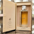 Lattafa kingdom women edp in open golden packaging on marble surface closeup view side angle shot