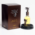 Eternal Oud Lattafa Pride perfume glass bottle on black round holder base