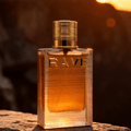 Au Soleil Rave edp perfume bottle on rock sunset golden hour closeup side