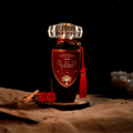 Mohra Lattafa edp bottle ornament flowers and dark wood nearby