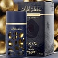 Lattafa Khalta Blend Of Lattafa Eau De Parfum 100ml — A dark blue perfume bottle with a textured, carved outer layer revealing gold accents inside, next to its matching cap with a gold circular emblem. | Lattafa Khalta Blend Of Lattafa Eau De Parfum 100ml — Botol minyak wangi biru gelap dengan lapisan luar bertekstur