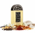 Lattafa Pride Maharjan Gold — A gold perfume bottle with a black mosaic cap and decorative panel sits next to its matching dark green embossed box. | Lattafa Pride Maharjan Gold — Botol minyak wangi emas dengan penutup mozek hitam dan panel hiasan duduk di sebelah kotak hijau gelapnya yang bertebuk.