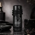 Lattafa Musamam Black Intense 100ml by Lattafa — Black snake coiled around a dark perfume bottle, with a textured black case in the background. | Lattafa Musamam Black Intense 100ml by Lattafa — Ular hitam melilit botol minyak wangi gelap, dengan bekas bertekstur hitam di latar belakang.