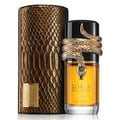 Lattafa Musamam Eau De Parfum 100ml by Lattafa — A golden snake coils around a clear glass perfume bottle filled with amber liquid, next to a textured brown cylindrical case with a snake-skin pattern. | Lattafa Musamam Eau De Parfum 100ml by Lattafa — Ular emas melilit botol minyak wangi kaca jernih berisi cecair