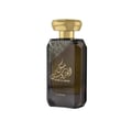 Lattafa Musk Al Aroos — A dark blue perfume bottle with gold Arabic calligraphy and 'MUSK AL AROOS LATTAFA' text, presented in an open dark blue gift box with a black velvet insert. | Lattafa Musk Al Aroos — Botol minyak wangi biru gelap dengan kaligrafi Arab emas dan teks 'MUSK AL AROOS LATTAFA', dipersembahkan dalam