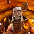 Asad Bourbon Lattafa edp lelaki botol kaca coklat dikelilingi dekat
