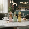 Eclaire Pistache Lattafa bottles on table Malaysian cafe setting closeup side