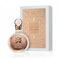 Fakhar Rose Gold Lattafa perfume bottle next beige packaging white background side view