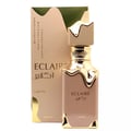 Eclaire Lattafa perfume bottle and box beige gold cap white background studio closeup